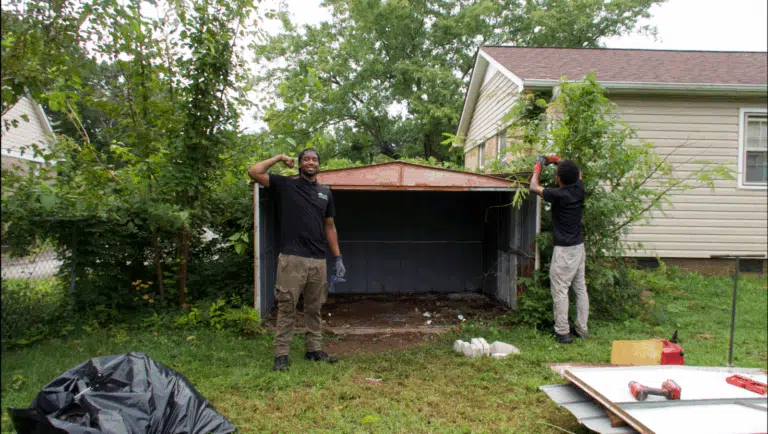 Metal shed removal and demolition – old rusted shed being dismantled